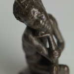 Sitting African Boy Figurine. Bronze. Hellenistic Period (330-30) BC.
